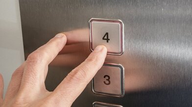 Finger pushing lift button